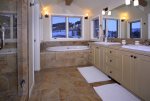 King suite with double vanities, soaking tub, and walk-in shower